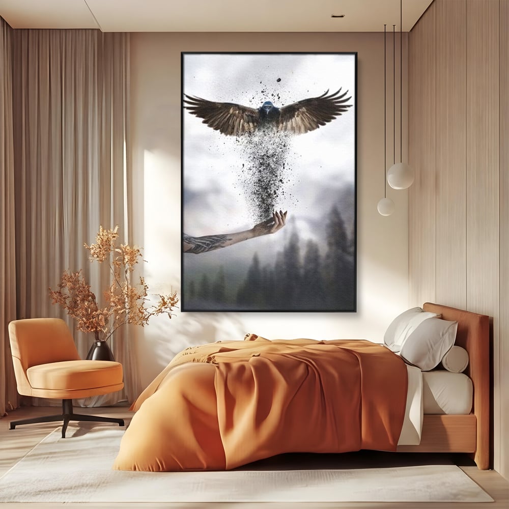 Tablou canvas cu tablou canvas cu pasare si mana din cenusa, in rama de aluminiu negru, pe perete intr-un dormitor